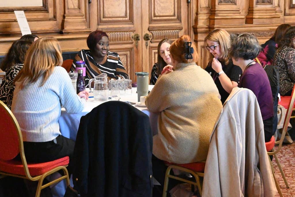 Photo of No Wrong Door Network event discussion with a group of attendees