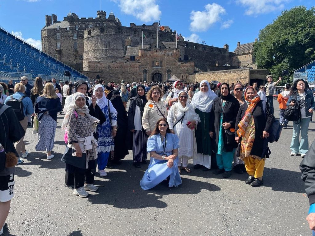 Awaz FM group gathered for a group photo in the sunshine
