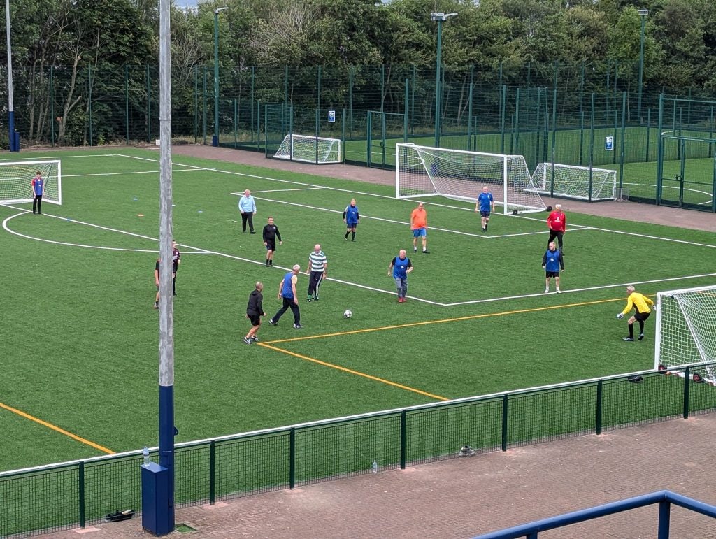 Castlemilk Community Football group on the pitch