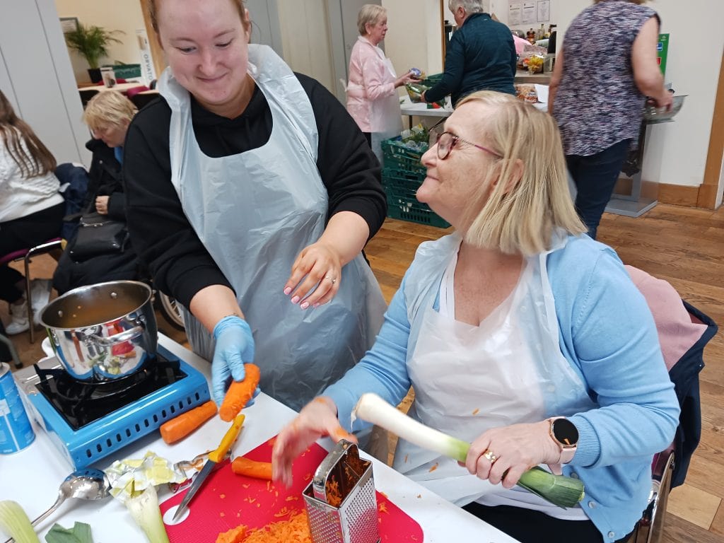 young at heart club participants cooking